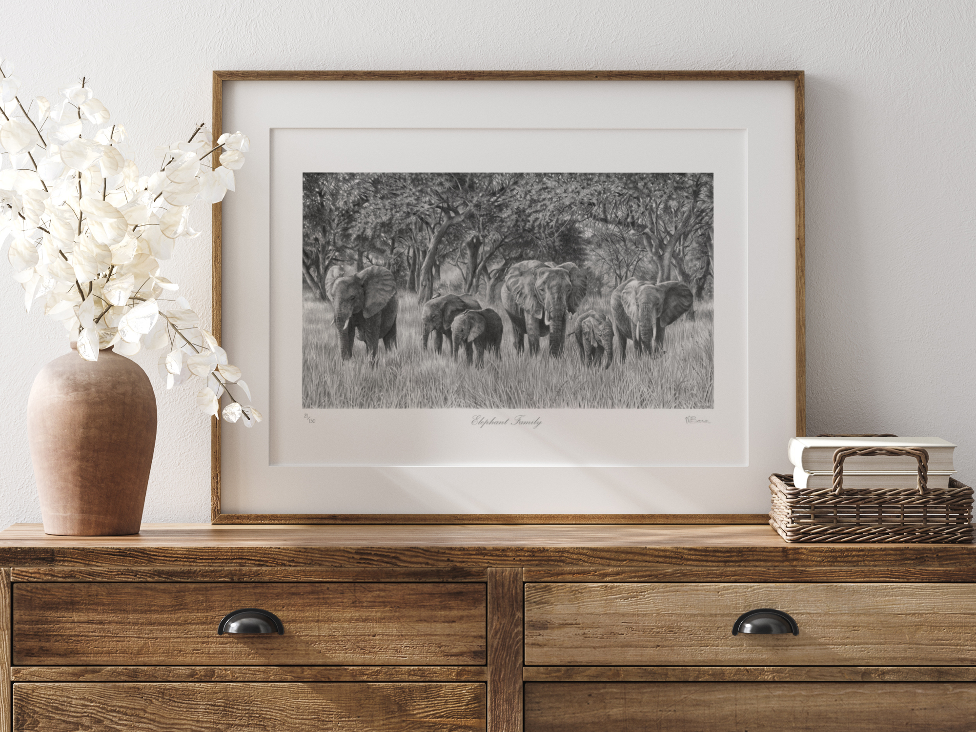 elephant limited editon print taken from a detailed pencil dawing by animal artist marie brown, framed in an oak frame on a wooden dressing table